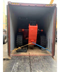 Heavy Duty Telehandler Telescopic Reach Forklift With Enclosed Cab inside a shipping container, ready for transport.