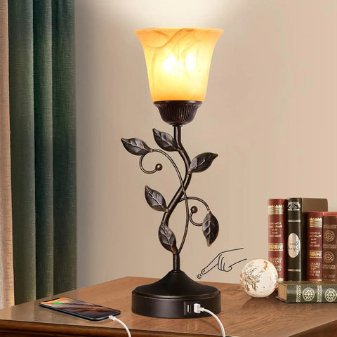 Touch Control Table Lamp With Two USB Ports, 3-Way Dimmable Bedside Light, Amber Glass Shade, Vintage Bronze Leaf Design on table