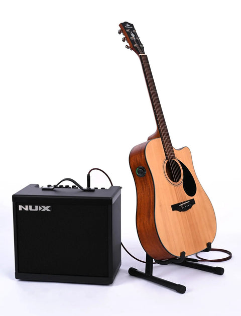 Dual Pickup Acoustic Guitar System With Piezo And Built In Microphone On Board Bluetooth Preamp Reverb Chorus And Delay Effects Adjustable Volume And Tone Plug And Play Gig Ready Tone For Live And Studio Sessions next to amplifier