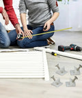 Couple assembling furniture with 30 Pack Drawer Wedges With Screws For Bottom Support Replacement Brackets in foreground