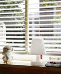 Tiny Rechargeable LED Lamp 2.0 Go Anywhere Dimmable Table Light on windowsill, white, USB rechargeable, indoor use.