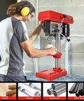 Person using 8 Inch Benchtop Drill Press With Built In Laser Guide And Bright Led Work Light For Wood Or Metal Drilling.