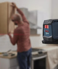 GLL50-20 50 Ft Self Leveling Cross Line Laser With Integrated Magnetic Mount and Battery Flexibility in action on jobsite