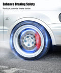 Automotive wheel front-side view with silver rim, spinning brake rotor and blue glow