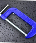Beefy Heavy Duty 4 Inch Woodworking G Clamp C Clamp with blue coating on wet surface for tabletop mounting and precise secure grips