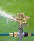 Impact Sprinkler Head On Metal Step Spike Heavy Duty Zinc Alloy Lawn Sprinkler spraying water with adjustable nozzle