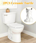 Set Of 2 Ceramic Cat Style Toilet Bolt Caps White Seat Screw Covers Heavy Duty Bathroom Hardware No Sweat Install Cute Decorative Anchor Caps For A Slick And Super Cozy Home Makeover on a toilet.