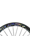 Close-up of 50mm Carbon Clincher Wheelset for 700c Road Bikes with silver decal and spokes visible, aero performance design.