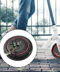 Close-up of 350W Brushless Hub Motor For Electric Skateboards And Longboards with scooter in background