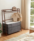 4 Pack Under Bed Storage Containers 95L Large Capacity With Reinforced Handles, neatly stacked under a garment rack in bedroom.