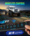Hand holding Eight Gang Slim Wireless Switch Panel For Cars RVs And UTvs With 208 Feet Range Drill Free Install No Wiring RGB Backlit