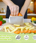 Orange-handle stainless steel crinkle cutter for slicing potatoes into crinkle-cut fries.