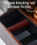 Heavy Duty Espresso Knock Box With Dedicated Tamper Dock Solid Wood Grind Catch Cup No Sweat Dosing Tray For A Clean Home Barista Kitchen Counter Setup showing silicone knocking rod for enhanced friction.