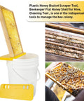Beekeeping Honey Uncapping Tank Holder For Easy Harvesting And Frame Scraper, mounted on a 5-gallon bucket, stabilizing honeycombs.