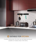 2 Pack Black Wall Hooks For Bathroom And Kitchen, Heavy Duty Towel And Coat Hooks, mounted above kitchen counter.