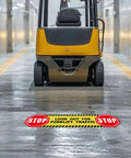 Five Pack Heads Up Watch Out For Forklift Traffic Floor Stickers 24 By 6 Inches Caution Safety Sign on warehouse floor near forklift