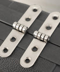 Six Piece Folding Door Hinges Set With Rust Resistant Finish Heavy Duty And Easy Install For Furniture And Decor, close-up view on black surface