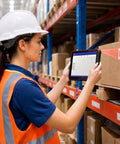 Woman scanning barcode with Tough As Nails Eight Inch Rugged Android Tablet With Integrated 1D 2D Barcode Scanner in warehouse.