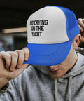Man wearing No Crying On The Yacht Distressed Lightweight Baseball Cap For Men And Women Royal Blue With Front Artwork Everyday Casual Hat For Outdoors Sports Or Travel Comfortable Fit Breathable Polyester, adjusting brim.