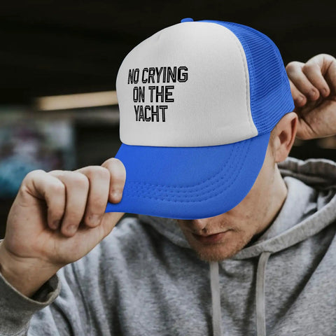Man wearing No Crying On The Yacht Distressed Lightweight Baseball Cap For Men And Women Royal Blue With Front Artwork Everyday Casual Hat For Outdoors Sports Or Travel Comfortable Fit Breathable Polyester, adjusting brim.