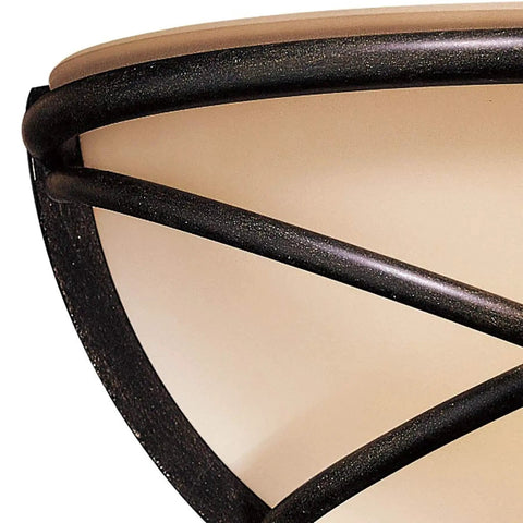 Close-up of Aspen II 1 Light Wall Sconce in Aspen Bronze, featuring rustic scavo glass shade and metal frame details