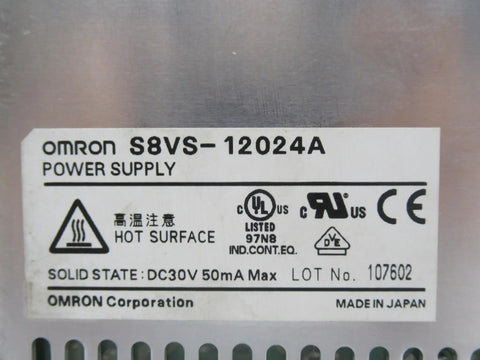 Close-up of Omron S8VS-12024A DIN rail power supply label with safety and certification markings, indicating solid state design.
