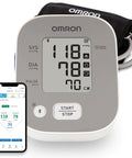 Bronze Upper Arm Blood Pressure Monitor For Home Use With Cuff Clinically Validated And Doctor Recommended Stores Up To 14 Readings Irregular Heartbeat Detection App Connectivity For Easy Tracking And Health Insights, showing digital screen and app interface