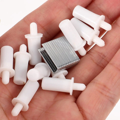 Pro Grade Plantation Shutter Repair Kit Featuring Rugged Window Pins And Heavy Duty Metal Staples For Zero Sweat DIY Fixes And Snappy Room Refreshes Today in hand, showing white pins and steel staples.