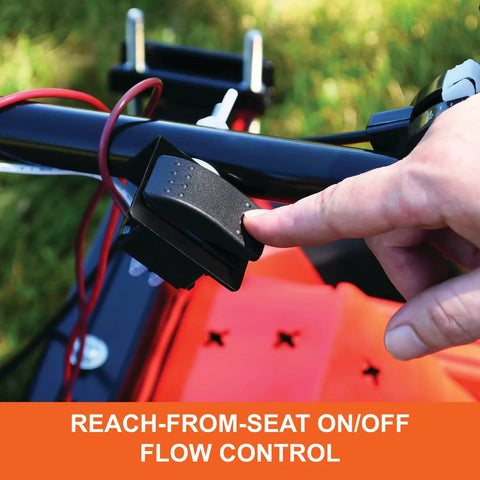 Hand using on/off switch on Zero Turn Mower Electric Spreader With 125 Lb Rustproof Poly Hopper Spreads Grass Seed And Fertilizer Up To 12 Ft Wide For Big Coverage 25000 Sq Ft Sealed 12V Motor Gate Control Made In USA
