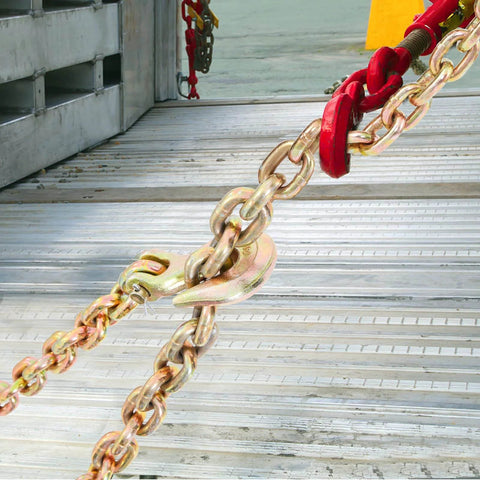 Close-up of Three Eighths Inch 20 Foot G80 Tow Chain with grab hooks on metal surface, galvanized manganese steel, 7100 lb WLL
