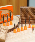 All-In-One 10 Piece TAC Coated CNC Router Bit Set Pro-Grade With One Quarter Inch Shank For Woodworking And Sign Making includes various bit sizes displayed with wood samples