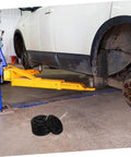 Car lifted with 4 Pack Jack Stand Pads Rubber Lifting Blocks For Vehicle Undercarriage Protection Universal Fit For Two Post Hoists