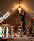 Heavy Duty Adjustable Support Pole Cabinet Jack Drywall Lift 45 To 114 Inch Telescoping Ceiling Prop in use holding up a ceiling lamp.