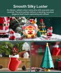 Christmas-themed models created with Silk PLA 4KG Bundle for 3D Printing in vibrant green, red, and gold colors.