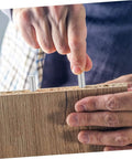 Person installing stainless steel dowel pins into wood, demonstrating 100 Pcs Dowel Pins Set Stainless Steel Cylindrical Fastening Pins for Machinery Electronics Automotive Applications Precision Fit Corrosion Resistant Easy Installation and High Stability to Prevent Loosening.