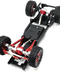 Chassis with adjustable metal RC drive shaft for 1/12 scale crawlers, telescoping 70mm-93mm, showing drivetrain assembly