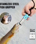 Hand holding fish with stainless steel gripper, part of 4 Piece Pistol Grip Fishing Tool Kit With 45 Degree Pliers Fillet Knife Gripper Line Snips And Fly Fishing Retractor With Retractable Lanyard For Anglers Includes Split Ring Head Hook Remover Wire Cutter Crimp Slots And Non Slip Grip. Max load 66lbs
