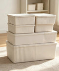 Kickass Plastic Storage Bins With Lids Full Set Decorative Boxes stacked in ivory color, heavy-duty, nestable for closet organization.