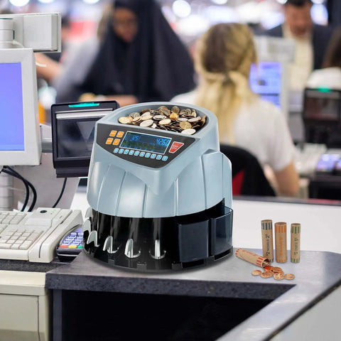 Countertop setup with coin counter and sorter machine with six bins counts up to 250 coins per minute in a busy shop environment.
