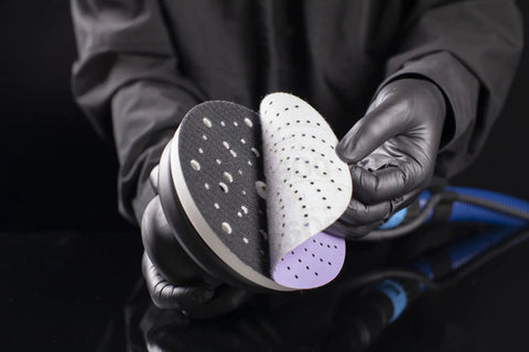 Kick Some Serious Grit With These 3M Cubitron II Hookit Abrasive Discs For Auto Work, showing two 3 inch abrasive discs held in hand.