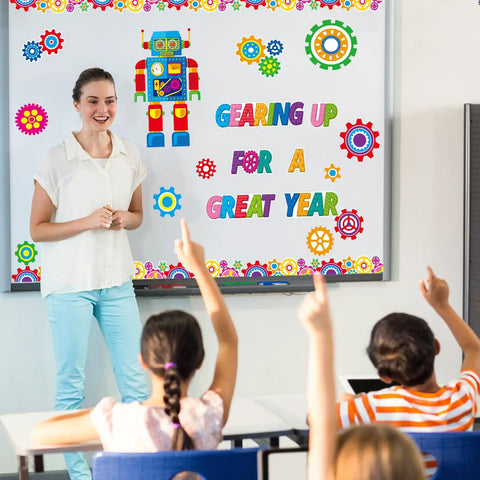 Teacher with robot bulletin board set and text 'Gearing Up For A Great Year' Gear Up Your Classroom With 52 Piece Robot Bulletin Board Set