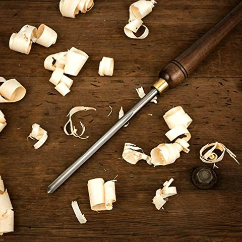 Badass Three Piece Bowl Gouge And Wood Chisel Set For Exact Lathe Work on wooden surface with wood shavings.