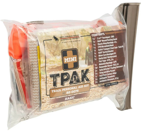 Mini T PAK Trail First Aid Kit for Backpacking and Camping with CAT Tourniquet, gauze, and emergency items in clear bag