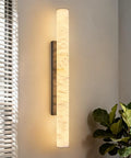 Natural Alabaster Wall Sconces Set Of Two Cylinder LED Wall Lights With Matte Black Metal Base Modern smooth glow mounted on wall.