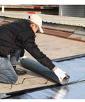 Man applying Heavy Duty Asphalt Crack Repair Tape And Concrete Sealant on cracked roof surface, showcasing 2mm thick material.