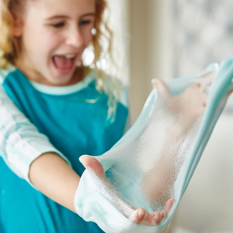 Child playing with slime made using Clear Liquid School Glue For Arts And Crafts, Go To Washable And Non Toxic, 32 Ounces Bottle.