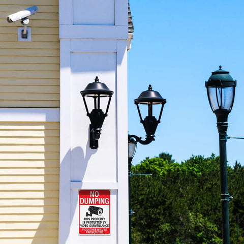 Large No Dumping Sign Keep Off My Patch Property Protected By Video Surveillance Reflective Aluminum Plate on exterior wall with lamps