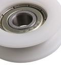 Four Pc U Groove Pom Pulleys With Eight mm Bore And 34 mm Outer Diameter close-up view of white POM pulley and inner bearing.