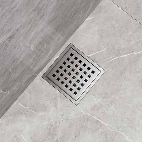 Modern Square Shower Drain With Brushed Nickel Finish No Fuss Install Rust Resistant Grid Cover Streamlined Design on grey marble floor.