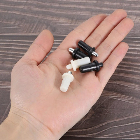 Kickass Spring Loaded Plantation Shutter Repair Pins For Window Louvers 50 Pack Metal Replacement Hardware in hand with black and white pins.
